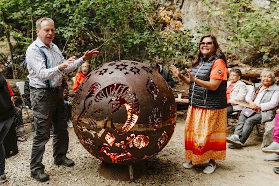 Chase Mayor David Lepsoe and Adams Lake Band Kukpi7 (Chief) Lynn Kenoras-Duck Chief help unveil the new Secwépemc Landmarks of Stelteglxús (Chase Creek Falls) on Sept. 27, 2024.