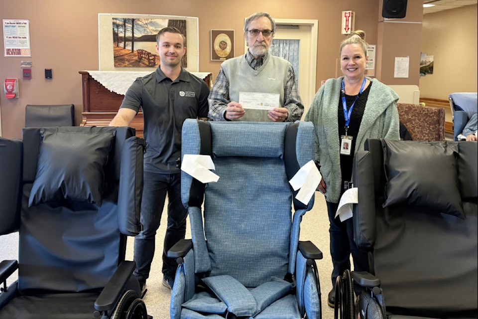 Bastion Place clinical operations manager Anita Russell receives three Broda wheelchairs from the Salmon Arm Rotary Club's Norm Brown and National Seating and Mobility. 