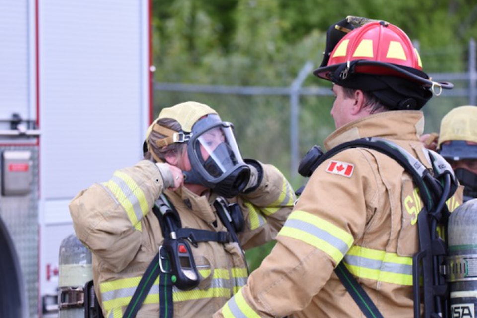 Observer reporter Heather Black gears up with assistance from Sicamous Fire Rescue Capt. Chris Wilson at the May 13 practice. 