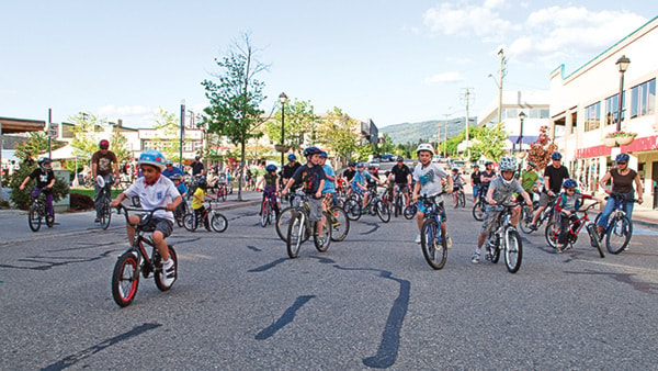 Riders get started on the Downtown Twilight Family Fun Ride Friday night.