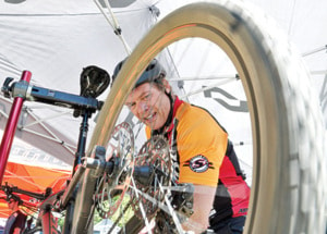 Skookum Cycle's Greg Scharf does some quick maintenance.