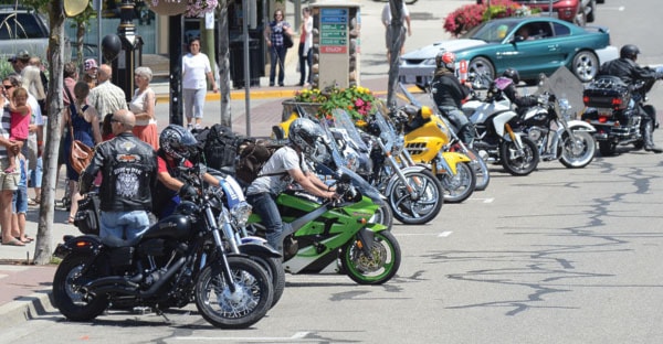 Motorcycles line the streets in the downtown area over the weekend.