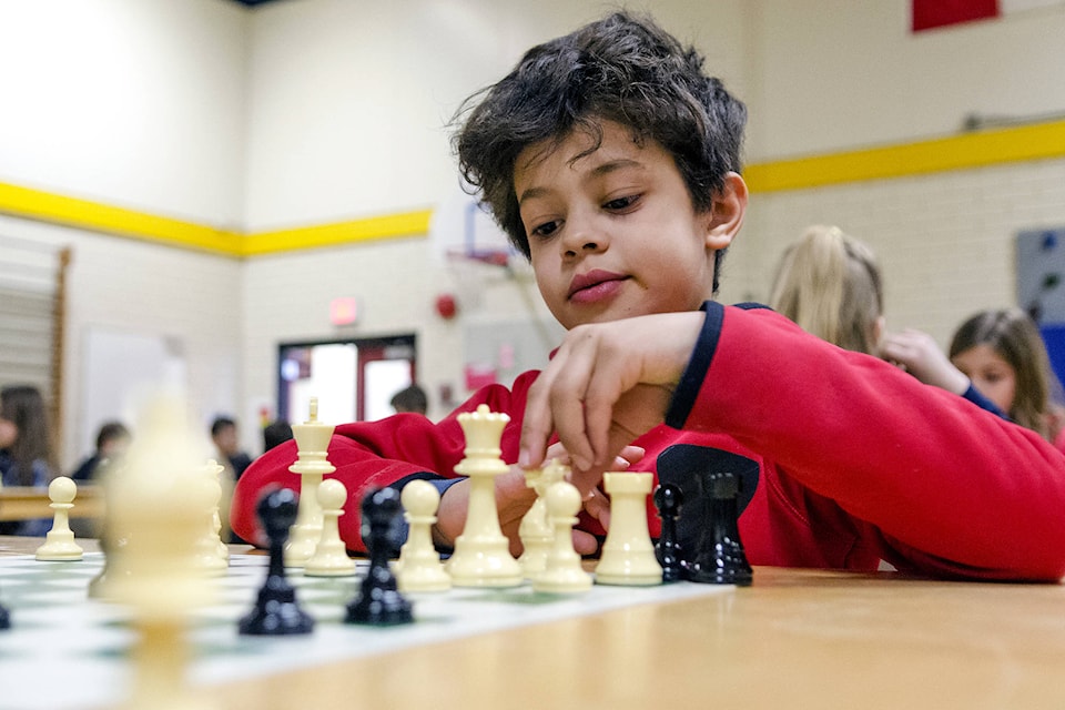 Bastion Elementary’s Chay Hutchinson makes his next move in a match he would quickly go on to win, advancing to the finals in the School District #83 elementary school chess tournament held at South Broadview on Wednesday, March 7. (Lachlan Labere/Salmon Arm Observer)