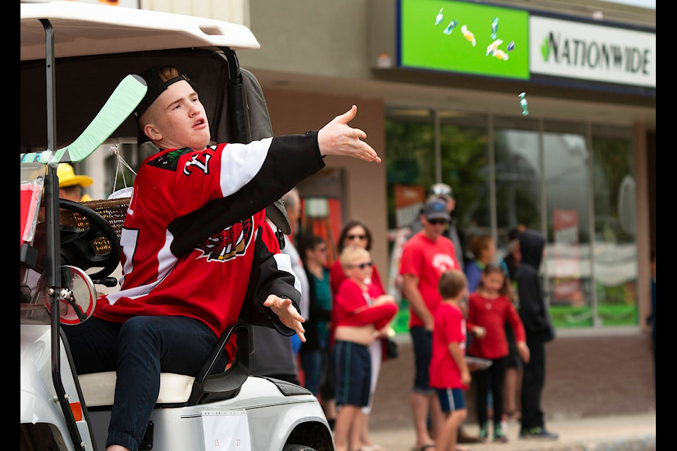 Chase Heat Brayden Haskell throws candy to children during the Chase Canada day parade Sunday July 1. (Rick Koch photo)