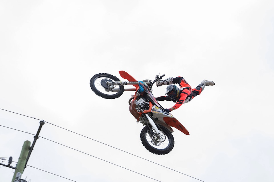 Reagan Sieg performs a death-defying stunt during the Freestyle Motocross show in downtown Sicamous. The motocross show was one of many thrilling events put on for bike day on Saturday, July 21. (Jim Elliot/Eagle Valley News)