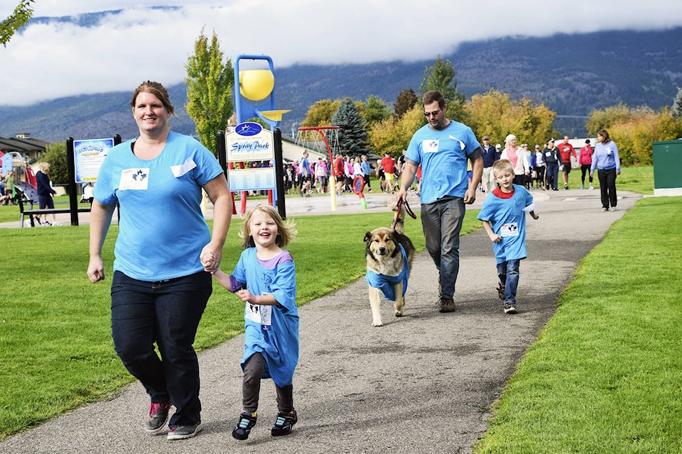 Tim and Kim Krabbendam with daughter Isabella, son Cody and dog Titan, make their way around Blackburn Park for theTerry Fox Run held Sunday, Sept. 16. The Krabbendams were doing the run for 13-year-old Jacob Bredenhof of Abbotsfordwho was diagnosed with osteosarcoma, the same type of cancer Fox battled nearly 40 years ago. (Martha Wickett/SalmonArm Observer)