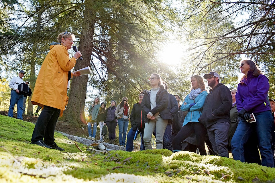 Deborah Chapman stands by the grave of Phillip Weinard, relaying tales from his adventurous life experiences that led him from Prussia, to the U.S., High River, Alta. and, eventually, Salmon Arm, during the Mount Ida Cemetery Tour on Sunday, Oct. 14. (Lachlan Labere/Salmon Arm Observer)