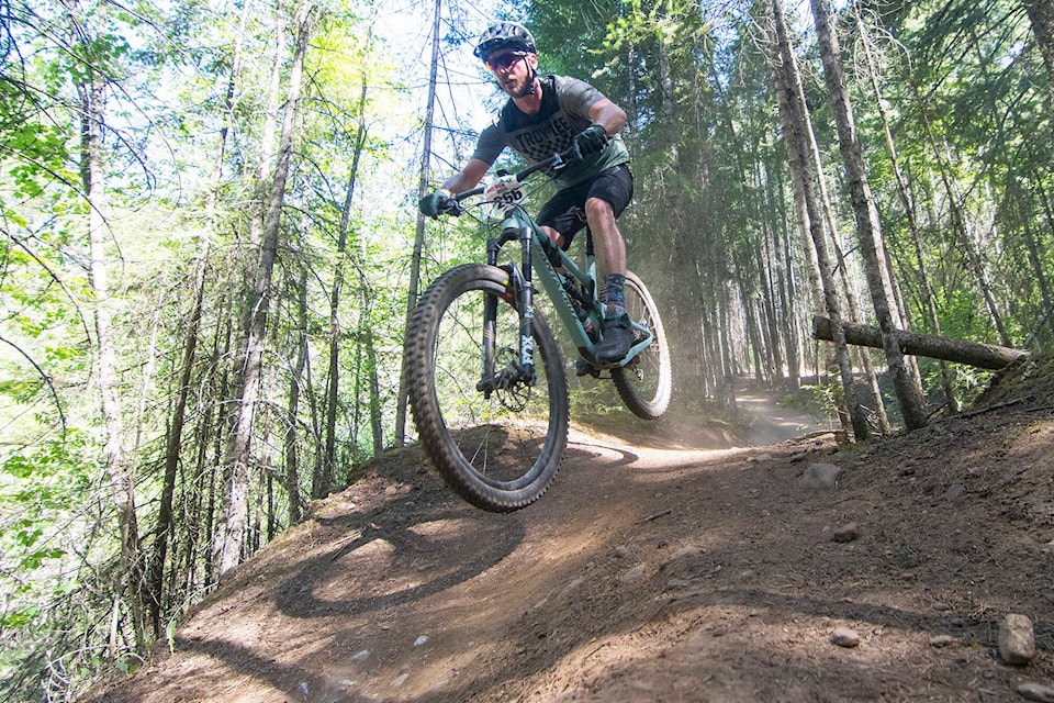 Both tires of Joal Borggard’s bike leave the trail as he races downhill near the finish line of the 2019 Salty Dog Enduro on Sunday, May 12. (Jim Elliot/Salmon Arm Observer)
