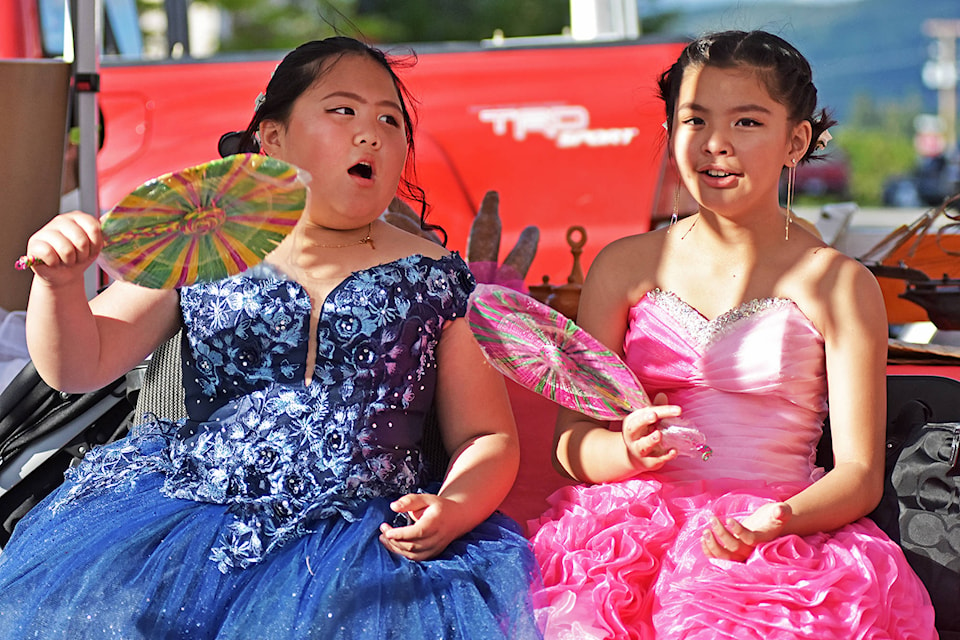 Rehannah Cruz and Rhose Bien keep cool in the shade during the Gathering Together Multicultural Festival at the Ross Street Plaza on Thursday, June 27. (Lachlan Labere/Salmon Arm Observer)