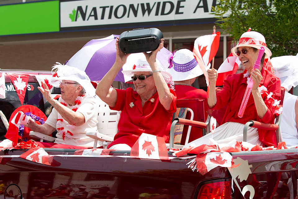 Parade participants share their love for their country in the Chase Canada Day Parade. (Rick Koch photo)