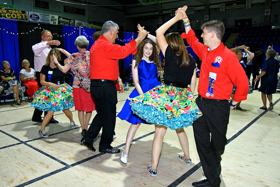 Nicholas and Caitlyn Brendzy spin next to Ray Brendzy and Erica Corsi at BC Festival 2019. (Photo by Brian Mohr/Shuswap Photo Arts Club)