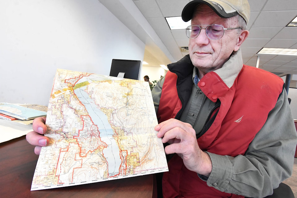 Penticton local historian Randy Manuel with a provincial map that has the original name of a mountain between Summerland and Penticton near where two men perished in 1908. (Mark Brett - Western News)
