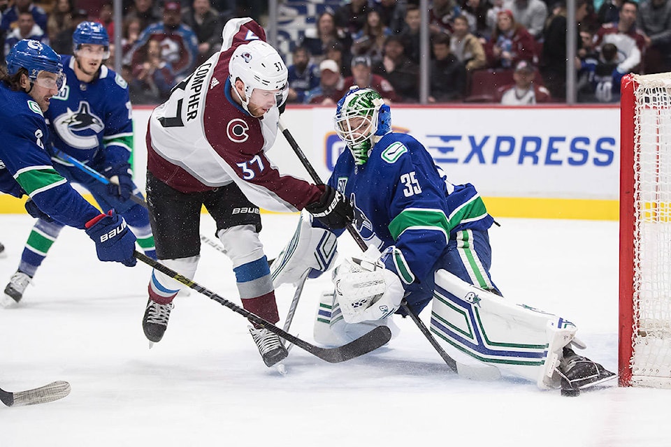 20842525_web1_200306-IFD-Canucks-Avs-win_1