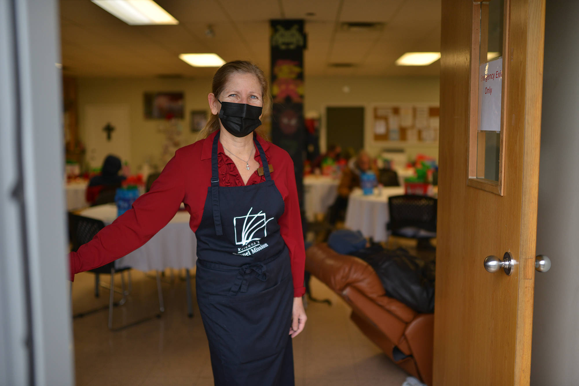 Sonja Menyes, Manager of Volunteers and the Gospel Mission, stands in the shelter doorway on Dec. 19. (Phil McLachlan - Capital News)
