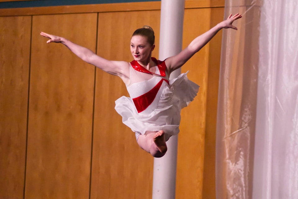 Alexa Robinson leaps in the finale of Shuswap Dance Center’s A Christmas Carol performance on Friday, Dec. 17, 2021. (Lachlan Labere-Salmon Arm Observer)