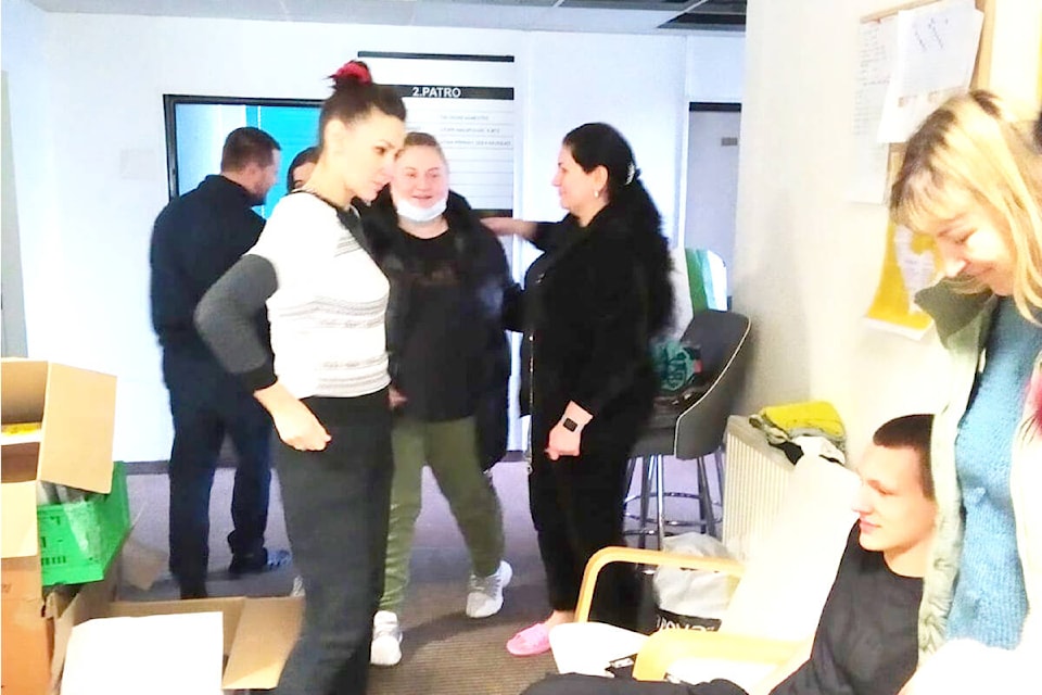 Volunteers at a shelter for Ukrainian refugees on the outskirts of Prague in the Czech Republic organize shoes and clothing for refugees on Monday, March 14. (Photo submitted)