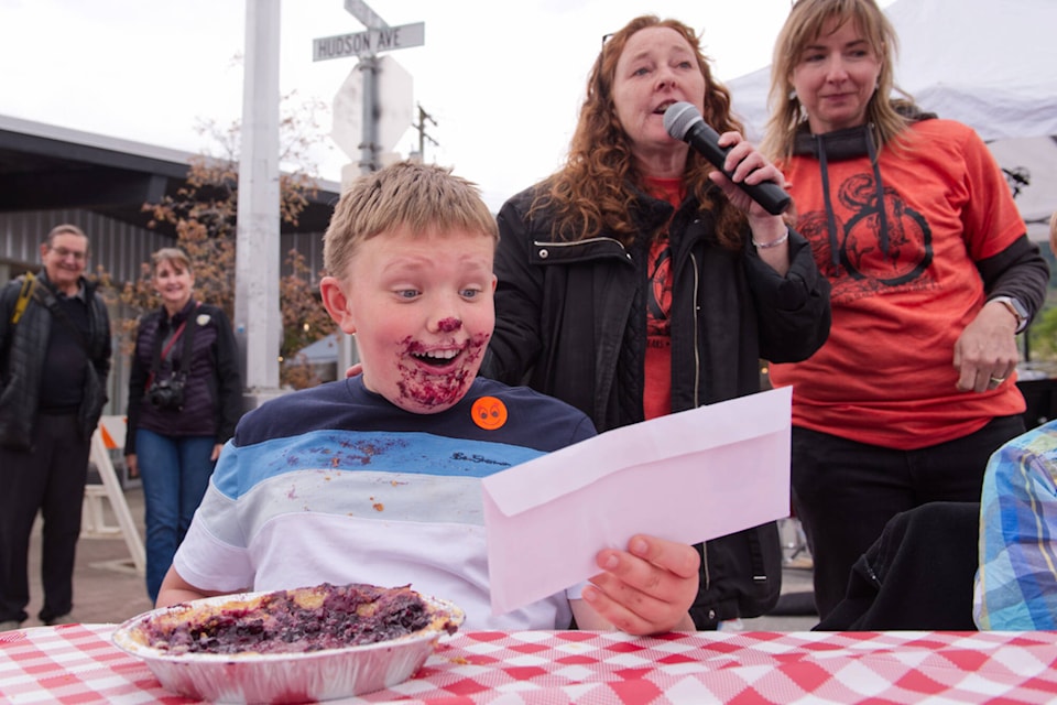 Liam Spencer is excited to have won a gift card to the Shuswap Pie Company after competing in the pie eating contest at the Salty Dog Street Fest in downtown Salmon Arm on Saturday, May 14, 2022. (Lachlan Labere-Salmon Arm Observer)