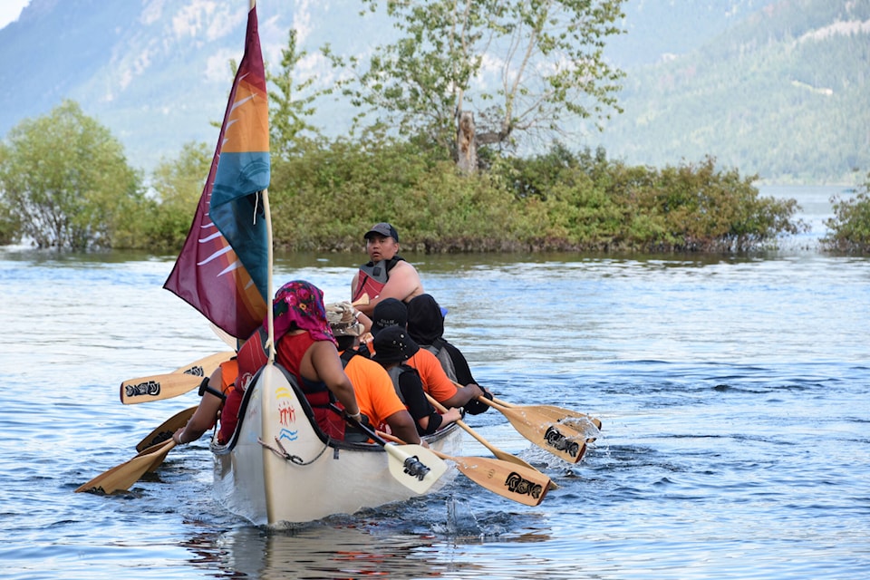 Adams Lake (Cstélnec) paddlers finish the July 15 journey from Blind Bay to Adams Lake as part of the 12-day 2022 Pulling Together Canoe Journey. (Martha Wickett - Salmon Arm Observer)