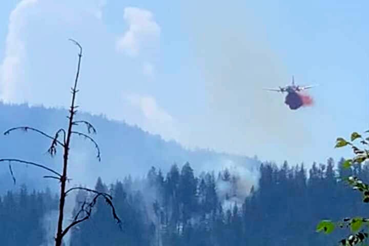 A bomber drops retardant on a fire near Cherryville Friday, July 29, 2022. (Katie Squair-Gamache photo)