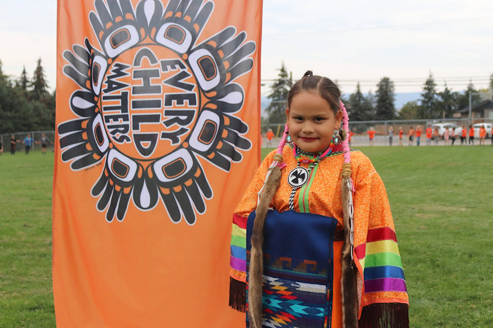 Jazmin Robins-Swanson, nine, performed a dance while wearing a traditional dress at Orange Shirt Day at BX Elementary School Thursday, Sept. 29, 2022. (Brendan Shykora - Morning Star)