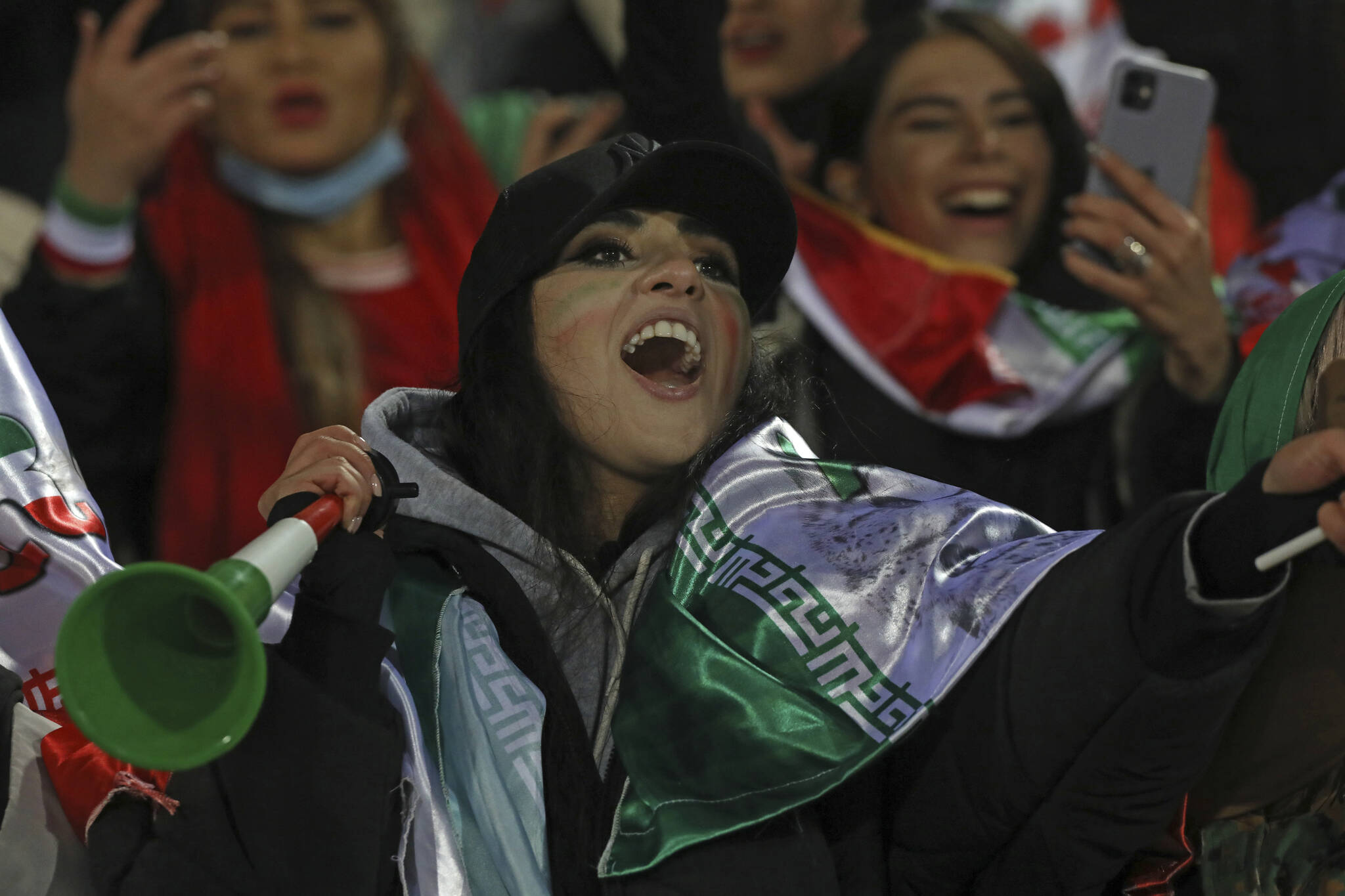 Barred from men's soccer games at home, Iranian women flock to World Cup in  Qatar