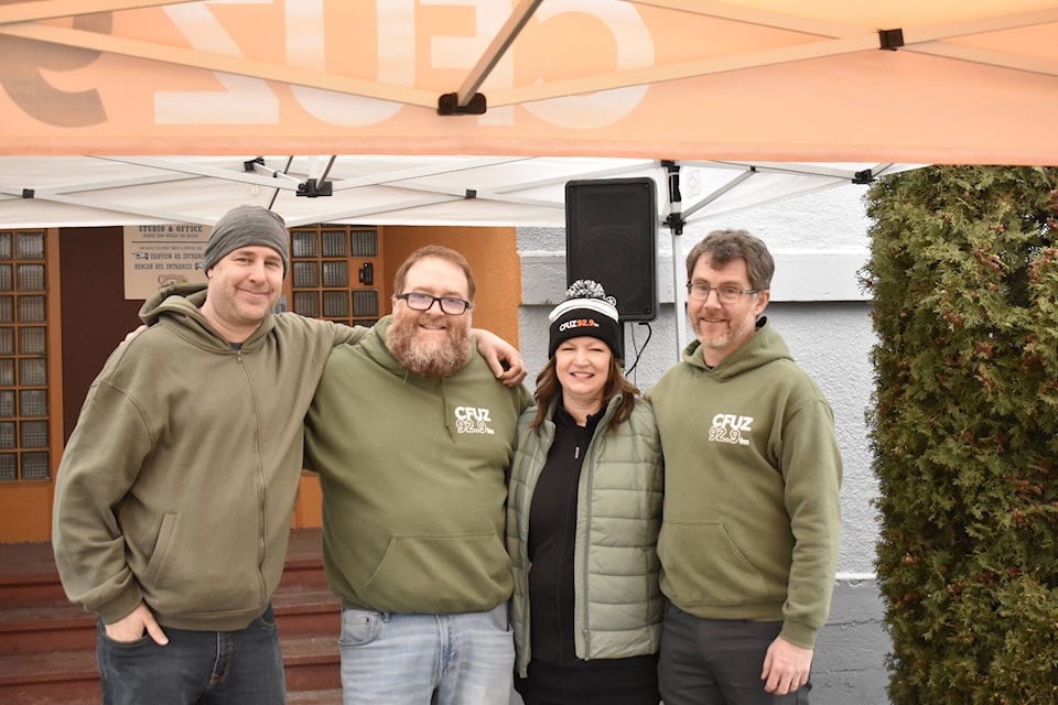 Volunteers from CFUZ Peach City Radio celebrate the station’s fourth anniversary on Saturday, Feb. 4, 2023. From left to right: Nils Finnsson (technical director), Dave Del Rizzo (vice president and program director), Jackie Del Rizzo (past president) and Cameron Baughen. (Logan Lockhart/Western News)