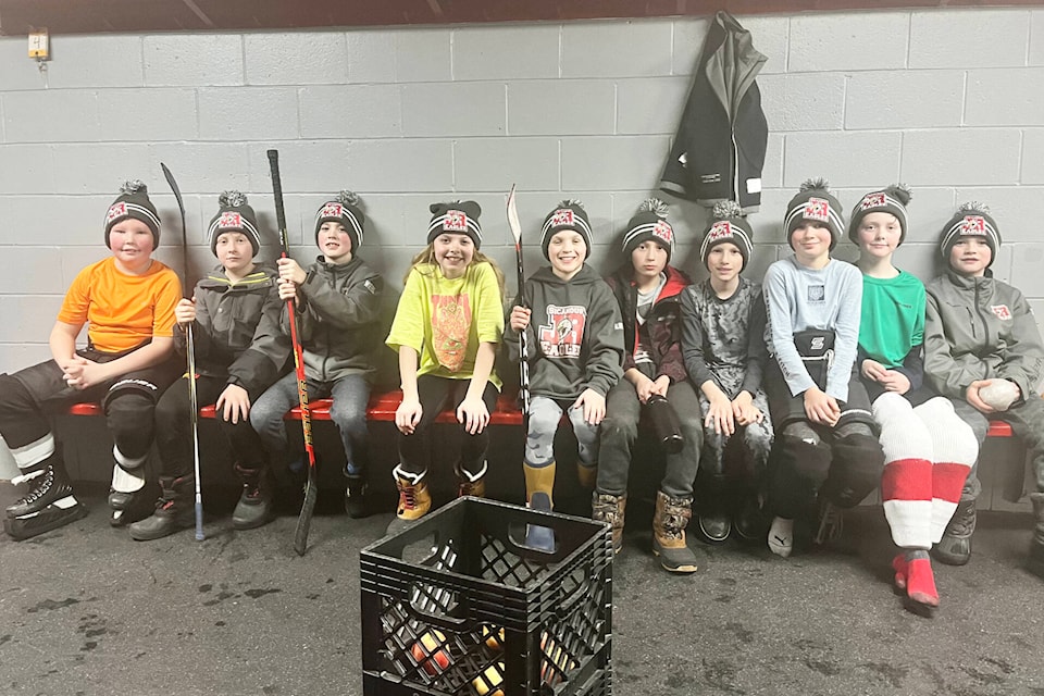 Minor hockey U11 players (from left to right) Cohen Dupuis, Nixon Dymond, Owen Wiebe, Quinn Carson, Finn Albisser, Jake McNab, Dustin Hilder, Kason Vandergaag, Zach Kennedy and Tyler Christian wear their team toques at a skills practice. The minor hockey Eagles U11 team has been taking part in skills development training with Junior B Eagles players and coaches since January 2023. (Contributed)