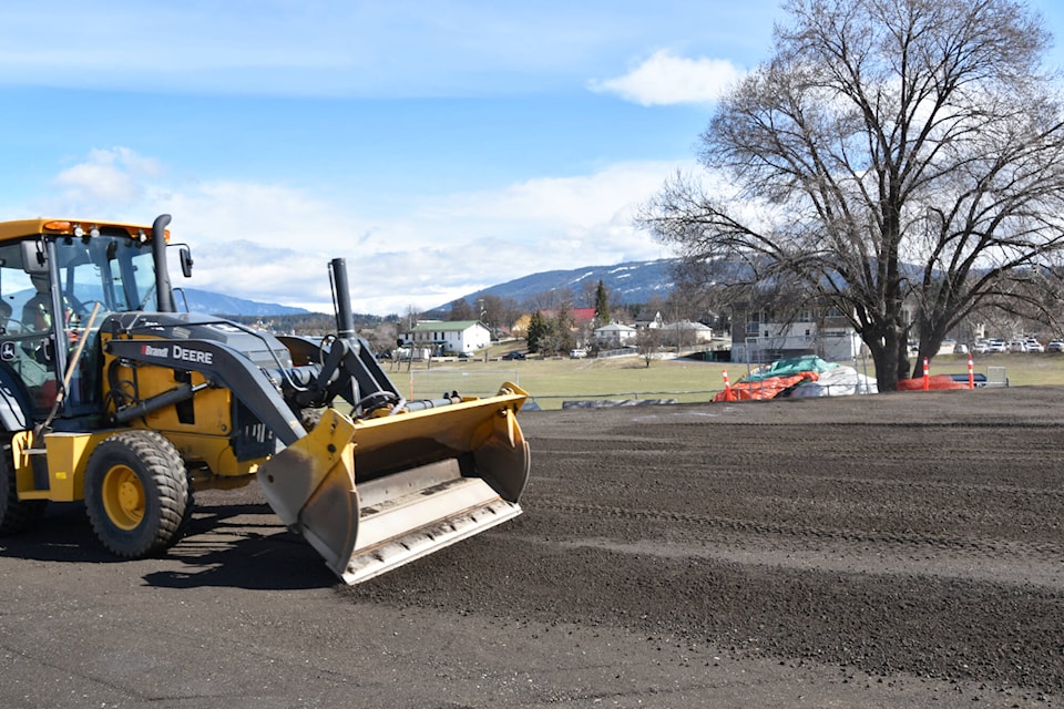 City crews resurface the Safeway fields parking area in Salmon Arm with fresh gravel on Monday, April 3, 2023. One tenter remained at the site although people could be seen moving belongings out of the tent shelter on April 3. (Martha Wickett - Salmon Arm Observer)