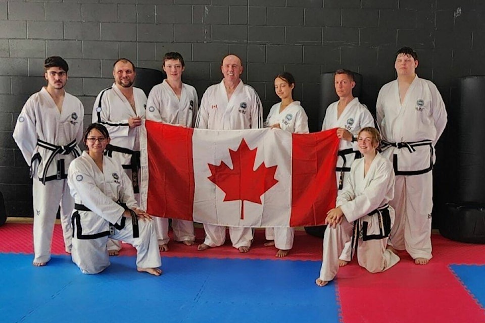 Jack Sharkey, 14, with teammates and coaches at a recent training camp held in Vernon. (Contributed)