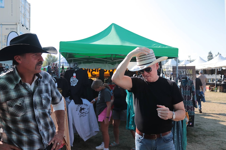 BC United leader Kevin Falcon purchases a cowboy hat on his first visit to the Interior Provincial Exhibition in Armstrong Friday, Sept. 1, 2023. (Brendan Shykora - Morning Star)
