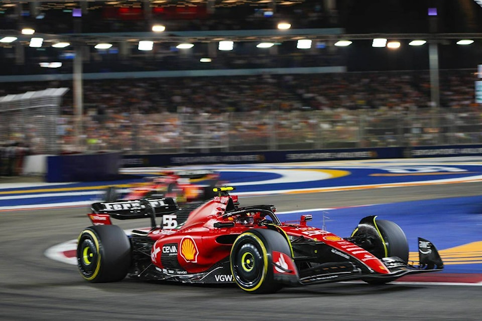 Ferrari driver Carlos Sainz of Spain steers his car during the Singapore Formula One Grand Prix at the Marina Bay circuit, Singapore,Sunday, Sept. 17, 2023. (AP Photo/Vincent Thian)