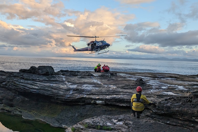 Juan de Fuca Search and Rescue volunteers help a hiker aboard a helicopter during a June 14 rescue from Juan de Fuca Trail. 