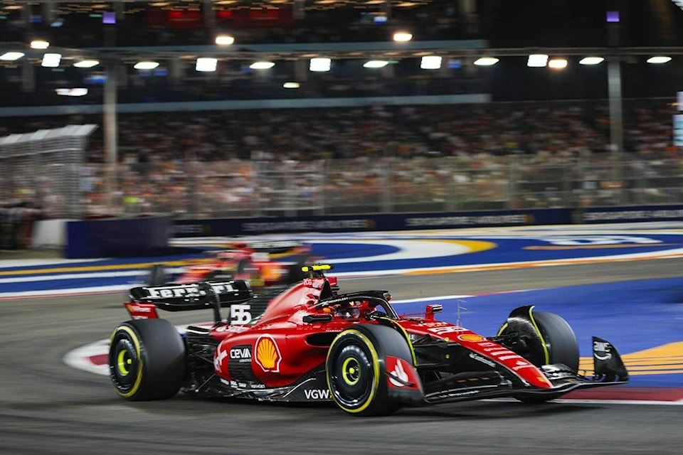 Ferrari driver Carlos Sainz of Spain steers his car during the Singapore Formula One Grand Prix at the Marina Bay circuit, Singapore,Sunday, Sept. 17, 2023. (AP Photo/Vincent Thian) 