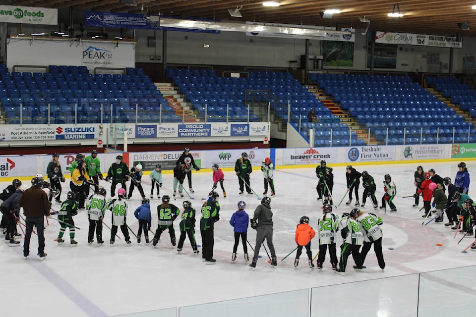 Members of the Comox Valley and Alberni Valley ringette associations gather with newly registered athletes at centre ice. (SONJA DRINKWATER / SPECIAL TO BLACK PRESS)  