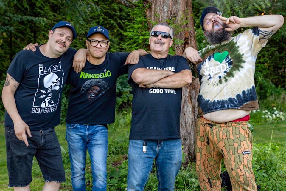 Danko Jones (centre-left) filmed the music video for his new song Get High in Maple Ridge, which featured Remo Colasanti (centre-right) and fellow musician Damian Abraham (right). (Danko Jones/Special to The News) 