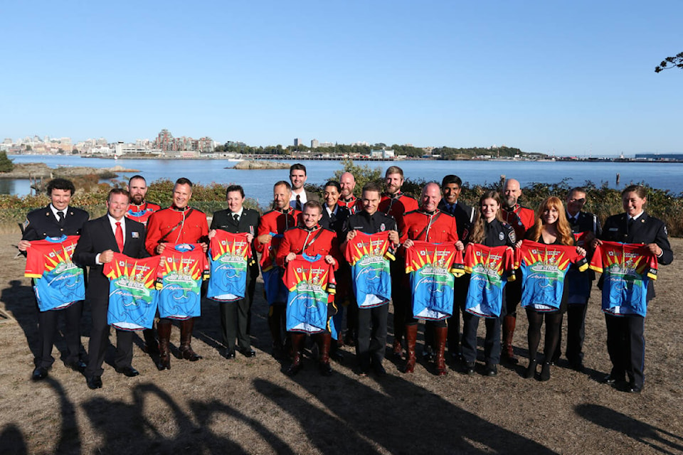 The 19 riders for this year’s Cops for Cancer Tour de Rock received their official jerseys Friday (Sept. 8) during the last official event before the 1,200 km ride begins Sept. 23. (Justin Samanski-Langille/News Staff) 