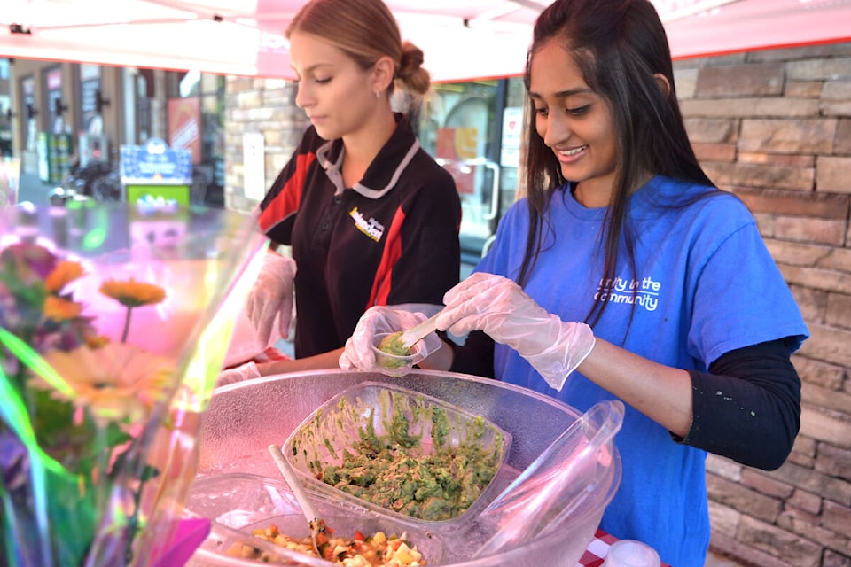 Staff at Hakam’s Your Independent Grocer gave out samples of in-house made guacamole and mango salsa at Willoughby Dayz 2023. (91ԭ Advance Times files) 