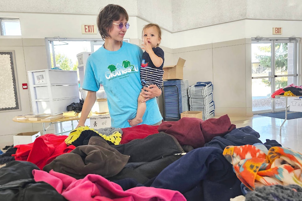 Clothes2U Volunteer Teagan Reid and son Draven at the ‘back in school’ giveaway held in Aldergrove at St.Dunstan’s church on Saturday, Sept. 9. (Dan Ferguson/Langley Advance Times)