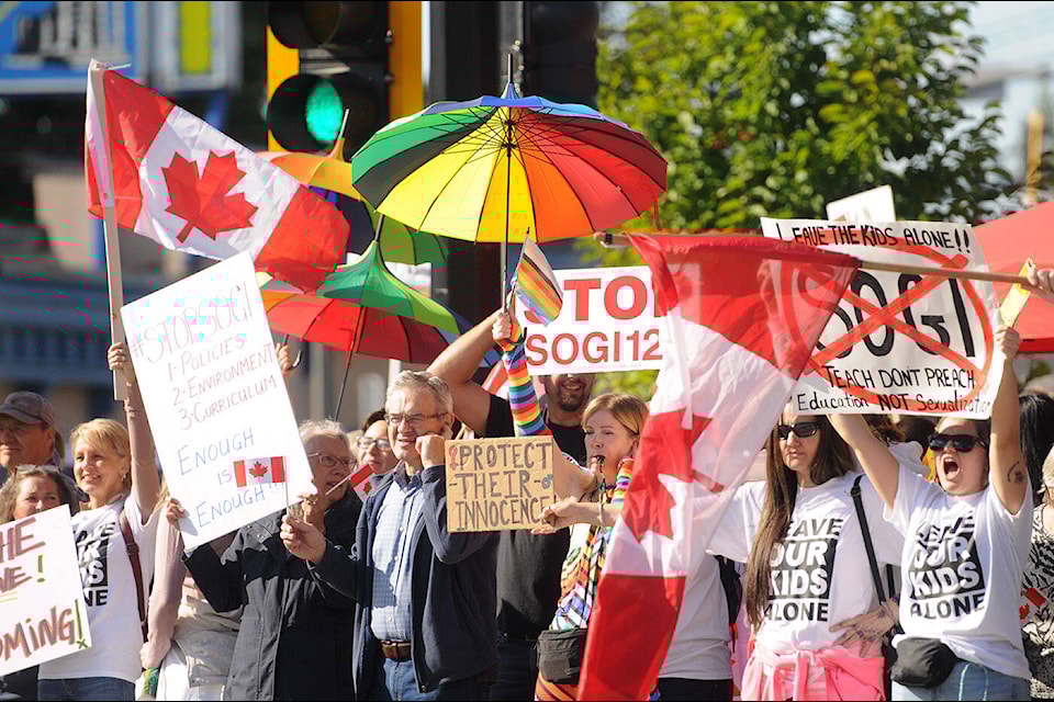 Anti-SOGI and pro-SOGI groups stood shoulder-to-shoulder at Five Corners in Chilliwack where an estimated 500 people participated in the 1 Million March 4 Children on Wednesday, Sept. 20, 2023. (Jenna Hauck/ Chilliwack Progress) 