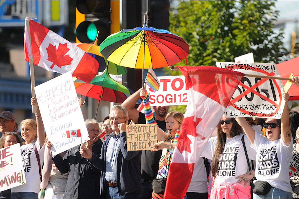 Anti-SOGI and pro-SOGI groups stood shoulder-to-shoulder at Five Corners in Chilliwack where an estimated 500 people participated in the 1 Million March 4 Children on Wednesday, Sept. 20, 2023. (Jenna Hauck/ Chilliwack Progress) 