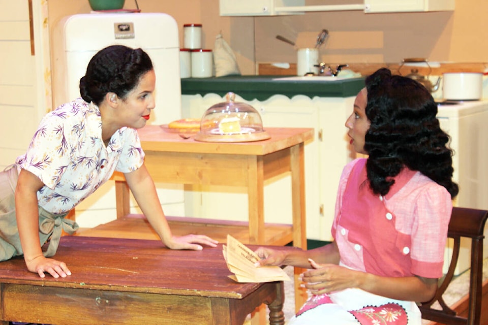 Rose (Rebbekah Ogden), left, comes face-to-face with Lucy (Jasmine Case) at the kitchen table. (Photo by Don Bodger) 