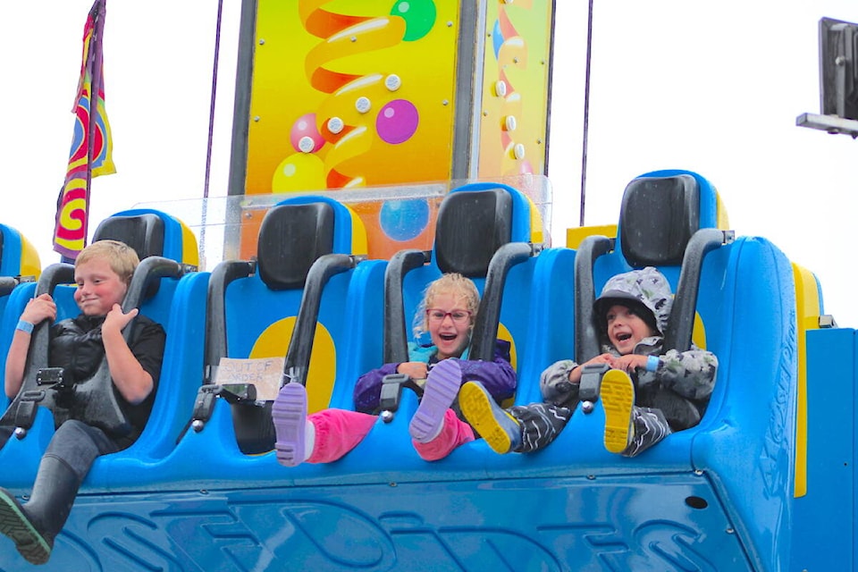 Kids enjoying the midway rides at the Luxton Fall Fair on Sept. 23. (Jake Romphf/News Staff) 