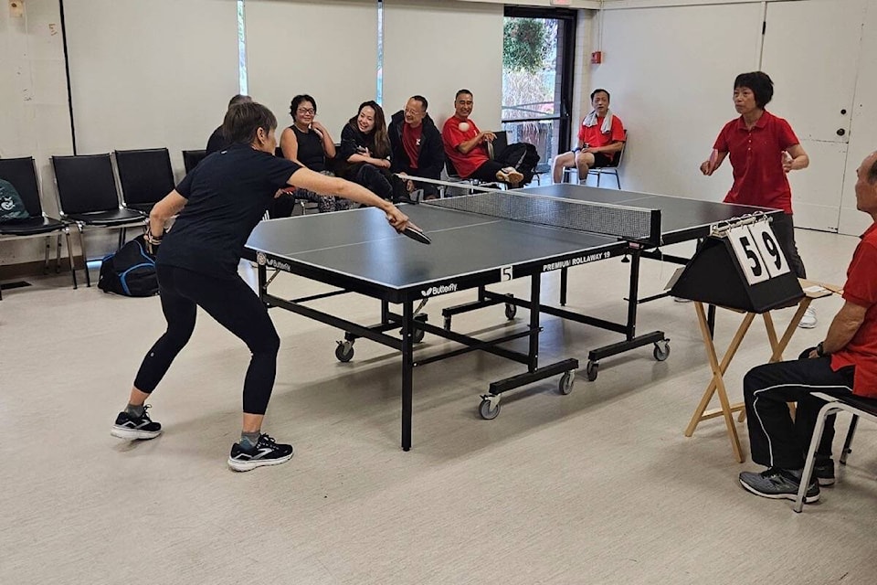The Monterey Table Tennis Club and Victoria Chinese Seniors (Silver Threads) Association battle for table tennis supremacy in a friendship tournament on Sept. 23 in Oak Bay. (Photo by Owen Toop) 