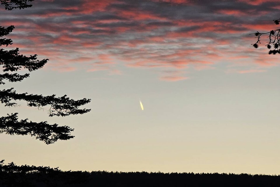 Saturday’s (Oct. 28) sunset over Canoe is highlighted by what mountain biker/photographer Kevin Silverson believes to be meteor. (Kevin Silverson photo) 