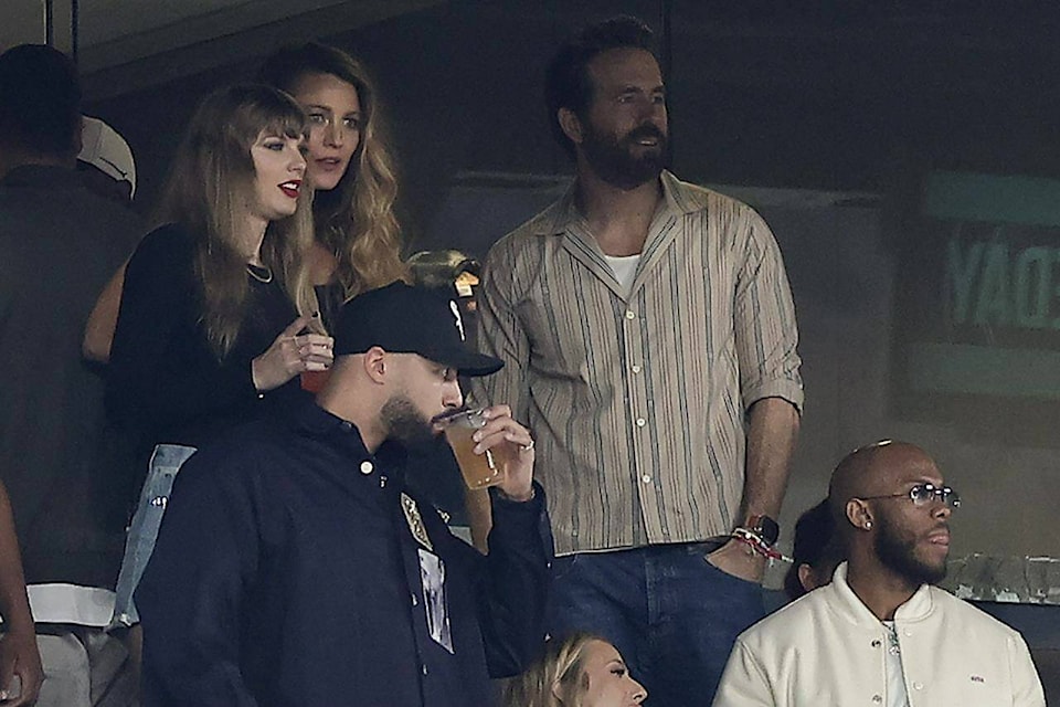 Taylor Swift, left, watches play between the New York Jets and the Kansas City Chiefs of an NFL football game, Sunday, Oct. 1, 2023, in East Rutherford, N.J. (AP Photo/Adam Hunger) 