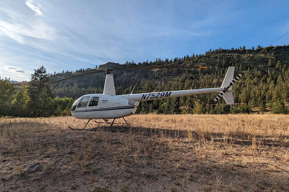 A helicopter believed to be the same one that crashed near Enderby last Saturday was spotted landing in Kalamalka Lake Provincial Park earlier in the day.  (Jessie Gottlieb/Facebook photo) 