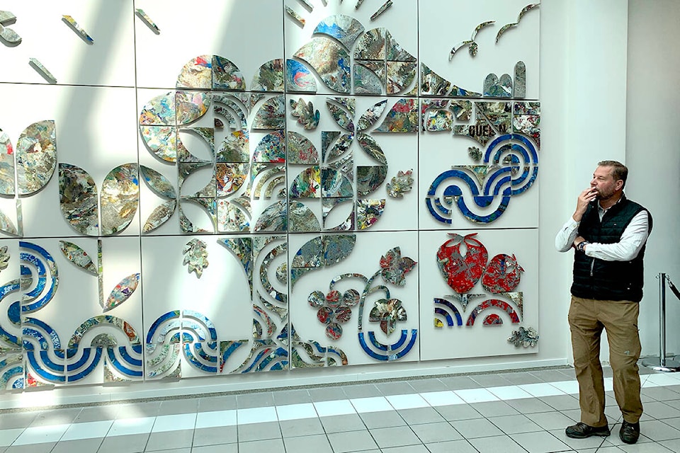 Roger Brenninkmeyer regards the art installation he created with Connor Simpson at Sevenoaks Shopping Centre in Abbotsford, on Sept. 13. The piece is made from soft consumer plastics that would likely end up in the landfill if not collected for the project. (Jessica Peters/Abbotsford News) 