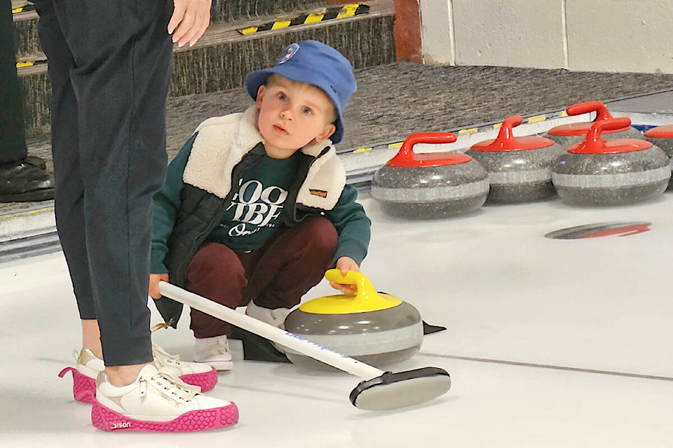 Mason Richardson, 3, from Brookswood, enjoyed his first taste of curling, a try-it event at the  Curling Centre to mark the 50th anniversary of the  Curling Club. (Dan Ferguson/) 