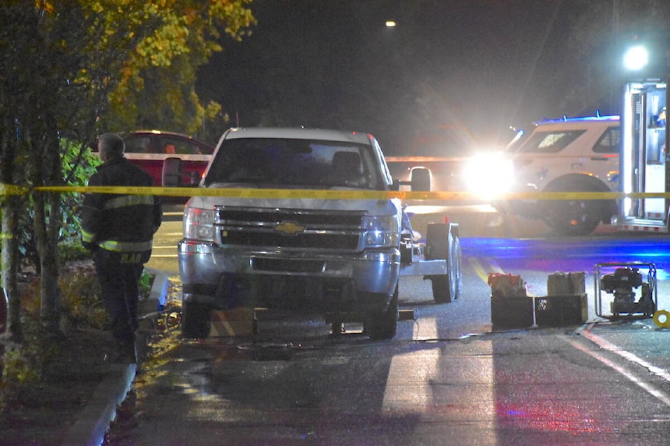  A 21-year-old woman from Surrey was taken to hospital after she became trapped underneath a pickup truck at the intersection of 202nd Street and 64th Avenue in 91ԭ on Monday night, Oct. 2. (Curtis Kreklau, South Fraser News Services/Special to 91ԭ Advance Times) 