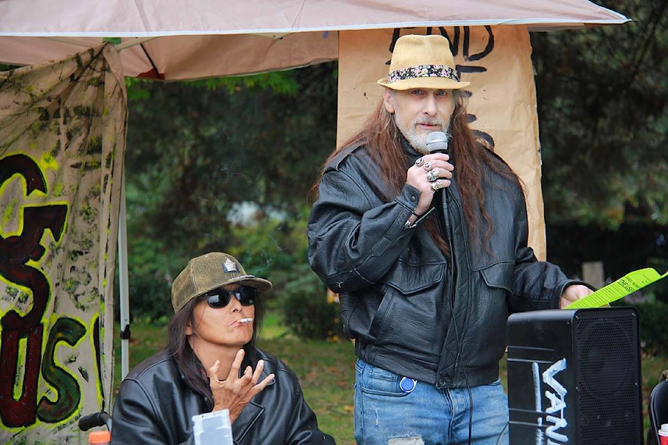 Vancouver Area Network of Drug Users (VANDU) board member Martin Steward speaks in MacLean Park in Vancouver on Oct. 4. The group says new provincial restrictions on public drug consumption will have deadly effects on the community. (Jane Skrypnek/Black Press Media) 
